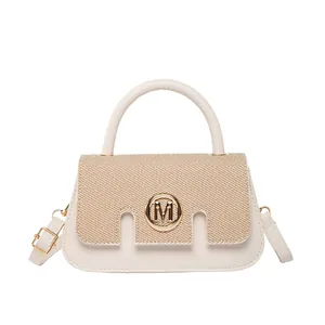 Modern patchwork top handle bag with straw texture and golden M metal ring logo