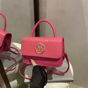 Hot pink crossbody bag with woven flap, gold M buckle and top handle for fashion