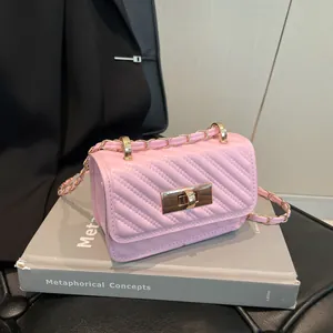 Pink chevron quilted mini crossbody bag with gold chain strap and metallic lock closure