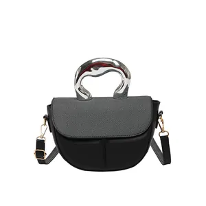 Minimalist black and grey patchwork saddle bag with artistic silver metal handle for women