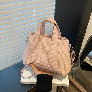 Pink striped fabric tote bag with wide handle and adjustable shoulder strap for women