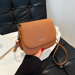 Brown woven saddle bag with adjustable strap and Fashion Trend print for women