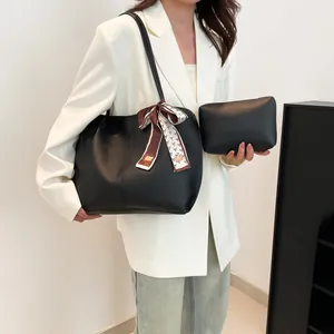 Elegant black leather tote bag set with patterned scarf and matching clutch for women