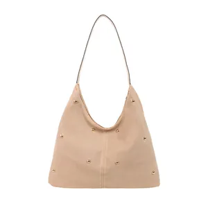 Modern beige suede tote bag with golden metal rivet accents and minimalist styling