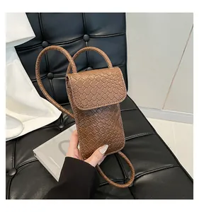 Brown hand-woven leather phone bag with round shoulder strap and flap closure