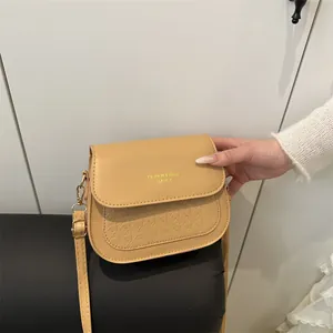 Minimalist khaki PU leather saddle bag with houndstooth texture and gold fashion lettering