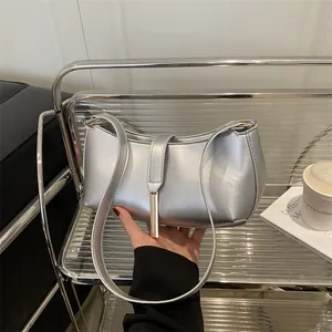 Minimalist silver metallic PU leather underarm bag with sleek metal decorative detail