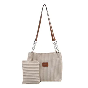 Off-white corduroy tote bag set with leather chain straps and a small matching pouch