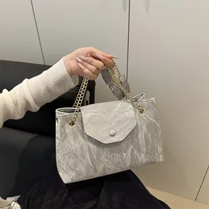 Silver shoulder bag with pleated texture and gold chain strap for women fashion