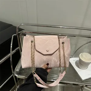 Pink marble pattern shoulder bag with gold chain strap and elegant pleated texture