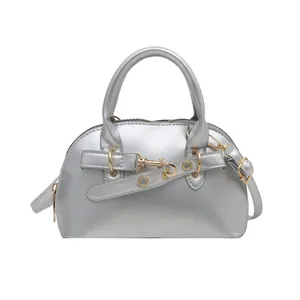 Retro silver shell shoulder bag with metallic finish and gold buckle hardware