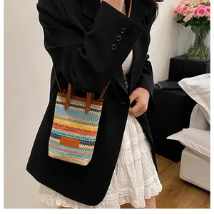 Detail of colorful striped straw woven bag with leather Fashion tag and handle