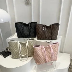 Large vintage printed tote bags in black, brown, beige and pink with M-letter pattern