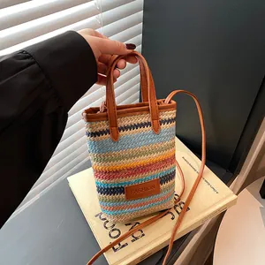 Colorful striped woven straw crossbody bag with brown leather straps for women