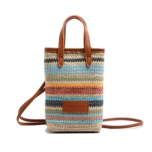 Vertical woven tote bag with colorful stripes and brown leather handles for summer fashion