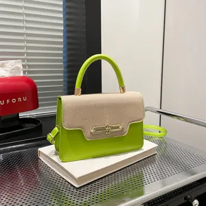 Neon green leather crossbody bag with beige woven flap and gold interlocking buckle