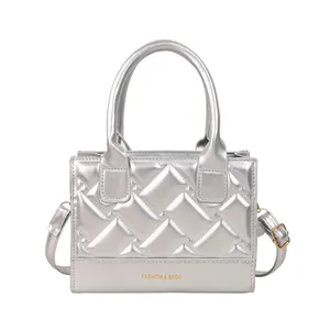 Silver quilted PU leather handbag with metallic texture and crossbody strap for women