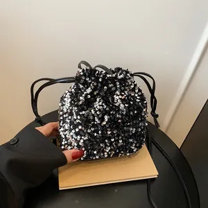Fashionable sequin bucket bag with drawstring closure and metallic silver finish