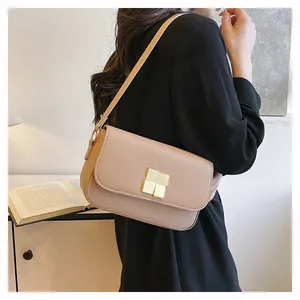 Detail showing high-quality beige PU leather texture and golden metal buckle on a shoulder bag