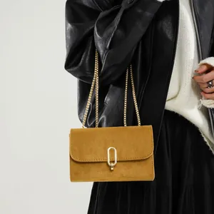 Vintage ginger suede crossbody bag with gold chain strap and oval buckle lock for women