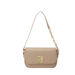 Minimalist beige leather shoulder bag with golden modular buckle and chain strap