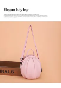 Detail showing pink pumpkin-shaped bag with pebble leather texture and adjustable strap