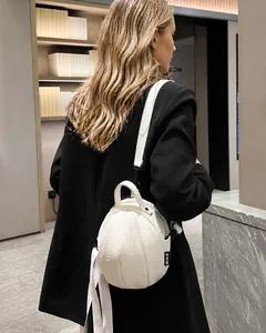 Detail of creative white basketball-shaped mini PU leather backpack with lychee texture