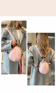 Detail of pink litchi pattern PU mini backpack showing single and double strap modes
