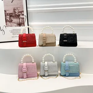 Chic mini handbags with pearl handles and chain straps in six diverse trendy colors
