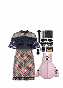 Close-up of pink litchi pattern mini backpack with fashion accessories and cosmetics