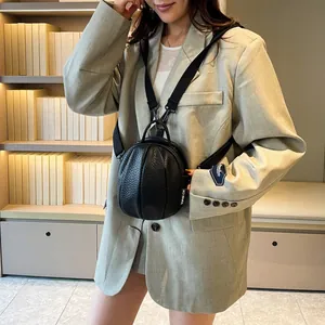 Black mini basketball-shaped PU leather backpack with lychee texture and adjustable strap