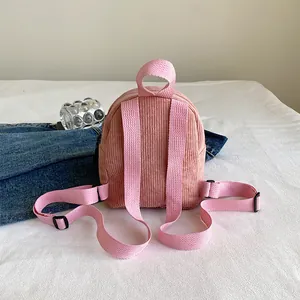 Pink corduroy mini backpack for women with adjustable straps and top handle for travel