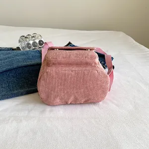 Pink corduroy mini backpack for women with adjustable straps and front pocket