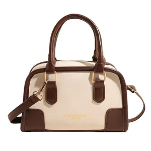 Vintage cream and brown faux leather Boston bag with top handles and gold hardware