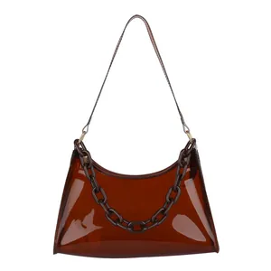 Brown translucent PVC hobo shoulder bag with a sleek resin chain and minimalist design