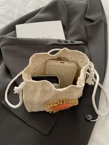 Borsa a secchiello in paglia beige con girasoli e chiusura a coulisse per vacanze estive