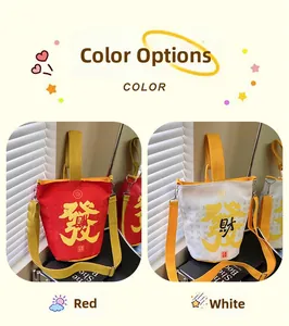 Detail of canvas bucket bags in red and white with fortune calligraphy and yellow straps
