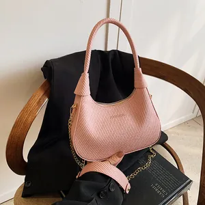 Chic pink woven texture half-moon underarm bag with sleek metal chain and top handle