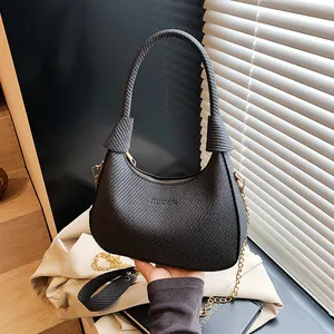 Chic black woven texture underarm handbag with gold chain strap and fashion logo