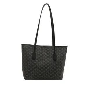Bolso tote negro clásico con estampado de letras M y correas largas de hombro