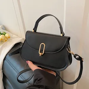 Classic black PU leather crossbody bag with gold oval buckle and top handle for women