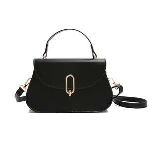 Classic black crossbody bag with matte finish and gold metal clasp on white background
