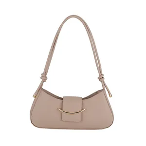 Minimalist light coffee shoulder bag with golden crescent buckle and knotted strap