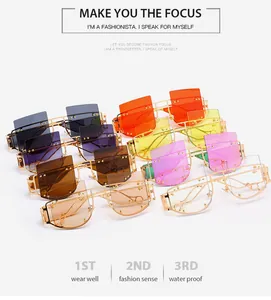 Macro view of multi-color rimless sunglasses featuring gold metal temples and cut-out details