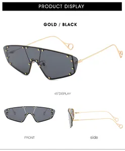 Detail view of gold metal frame sunglasses with black lenses and rivet accents