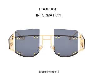 Close-up of oversized rimless sunglasses with gold rivets and hollow geometric metal temples