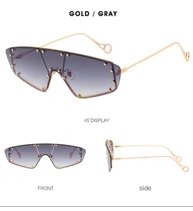 Detailed views of gold rimless sunglasses with gradient lenses and rivet accents