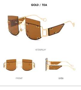 Detailed views of oversized rimless gold sunglasses with tea lenses and rivets