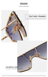 Close-up of purple gradient oversized sunglasses with gold rivets and texture frame