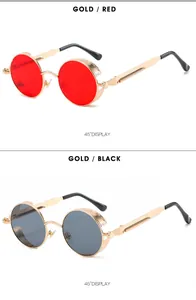 45-degree angle of steampunk round metal sunglasses in gold with red and black lenses